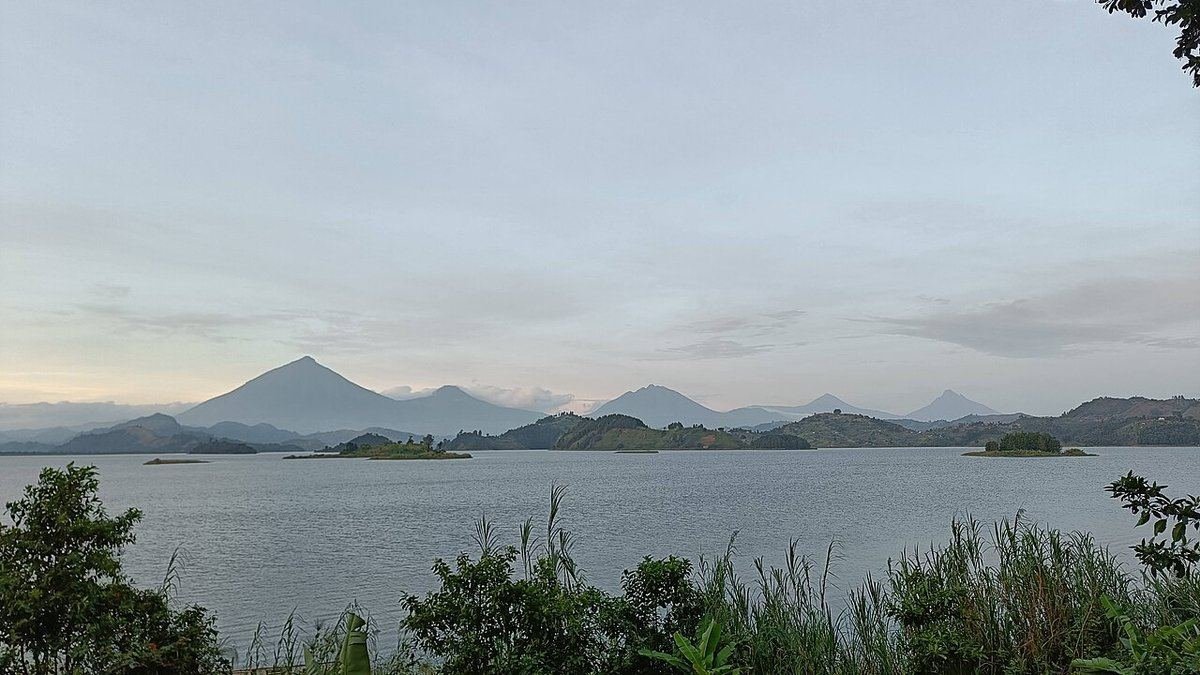 The Virunga volcanoes, including Muhavura, Gahinga and Sabinyo, seen across Lake Mutanda in Kisoro District