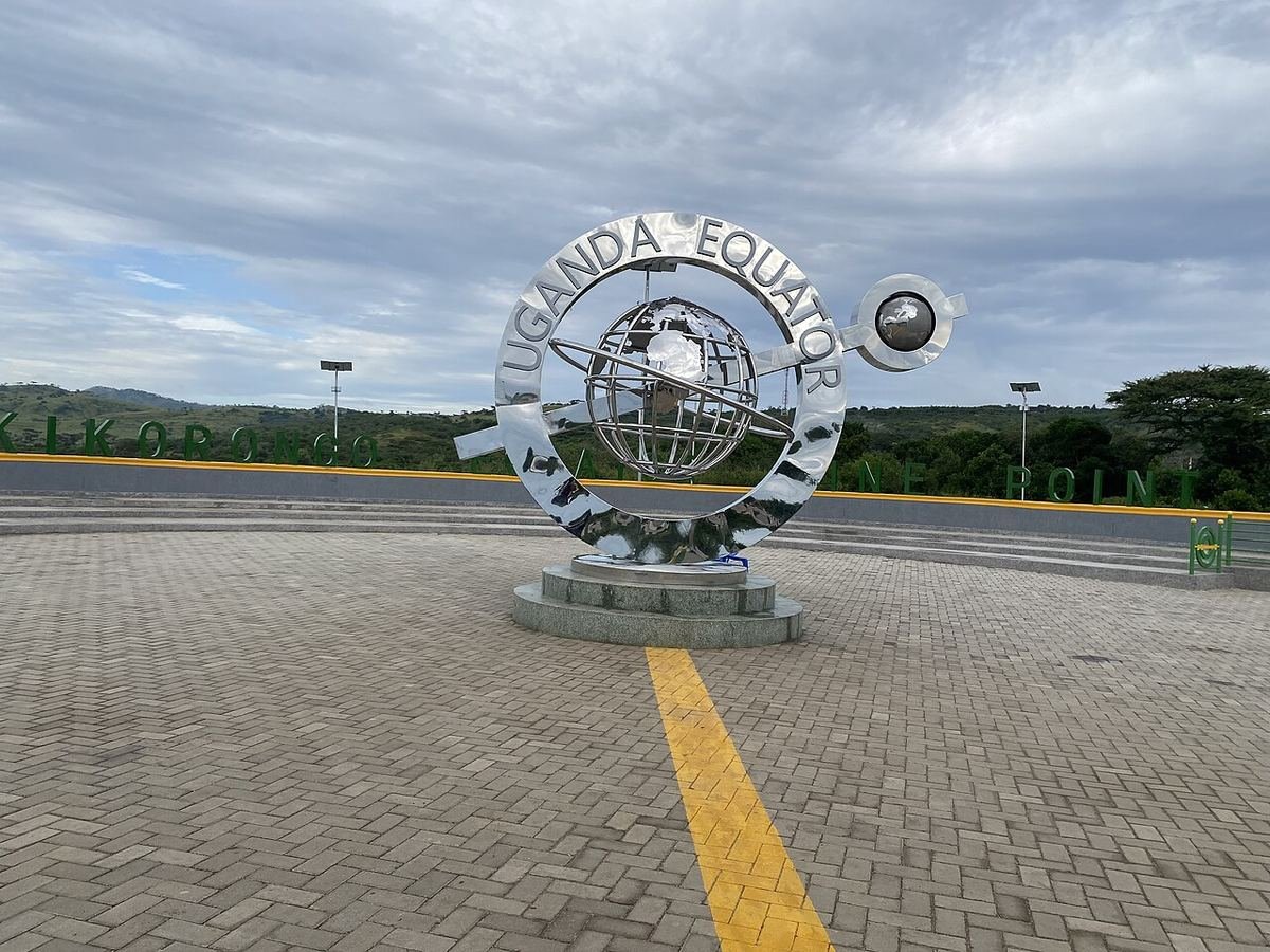 The Uganda Equator monument at Kikorongo, with a yellow line painted across the paving