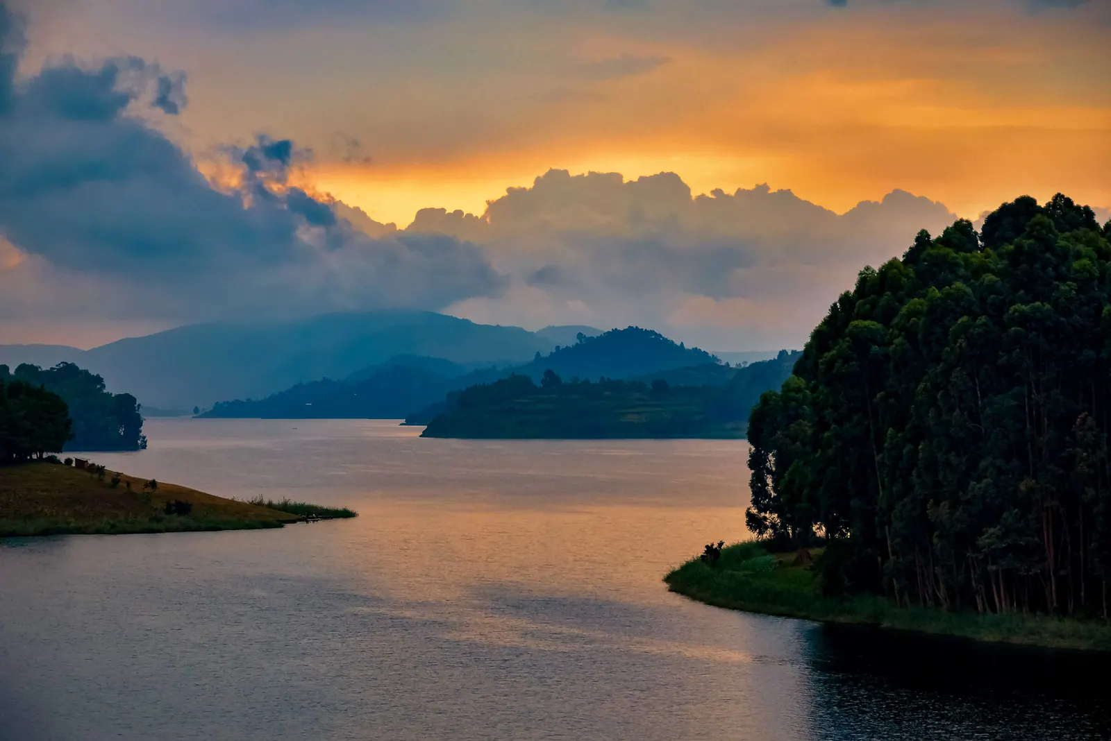 Islands and forested hills on Lake Bunyonyi at dusk