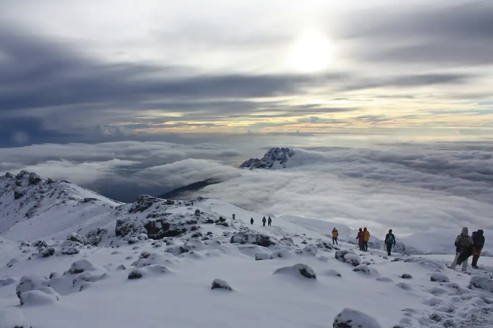 Sunrise above the clouds near Uhuru Peak on Mount Kilimanjaro